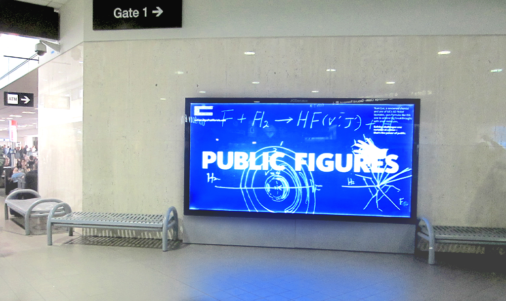 Digital screen in airport showing scientific diagrams on chalkboard and the words Public Figures